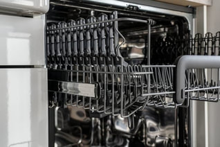 Photo of an open dishwasher